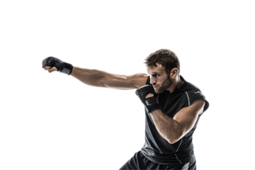 A determined martial artist in black workout gear delivers a powerful punch. His clenched fists and focused gaze show intense concentration, speed, isolated on a transparent background