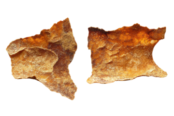 Ancient broken pottery shards whisper tales of forgotten civilizations warm textured surface studio shot