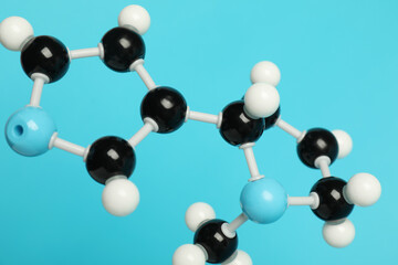 Chemical model of molecule on light blue background, closeup