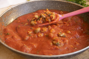 tomato sauce with sea snails
