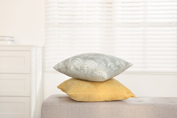 Soft decorative pillows on sofa in room
