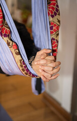 Detail of hands meditating in a yoga session