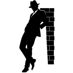 Mysterious Man Silhouette Leaning Against Brick Wall in Fedora