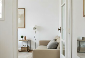 Interior design of a living room with a white wall, a beige sofa with a pillow , a pendant light and a painting , seen through a white door 