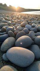 Obraz premium Smooth beach stones at sunset, coastal background, tranquil scene, perfect for travel brochures