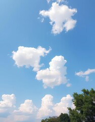 Obraz premium Vast, pale blue sky dotted with fluffy white cumulus clouds, heavenly, partly cloudy, cloud texture