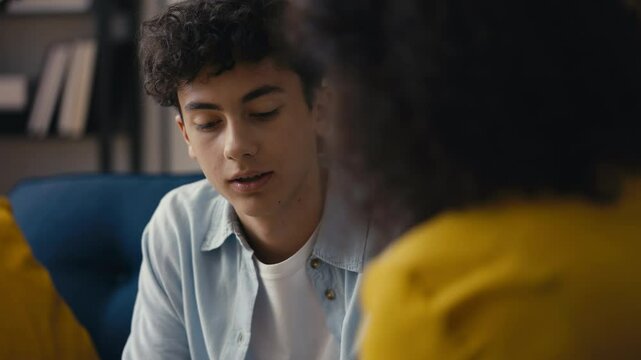 Mother disciplining her teenage son for misbehavior, having frank discussion