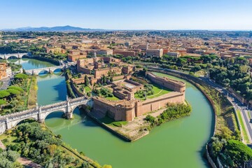 Aerial view of ancient fortress surrounded by river and cityscape under clear blue sky