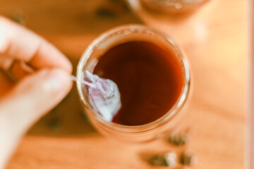 Red tea or called “ Dragon blood tea ” in the small clear glass