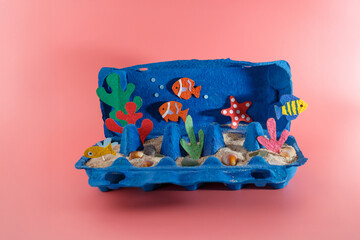 Whimsical ocean diorama created from upcycled egg carton. A unique and eco-friendly way to craft...