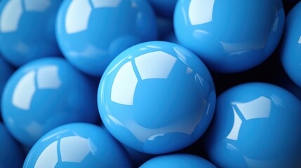 Fototapeta premium Close-up of shiny blue spheres clustered together, reflecting light in a dark background