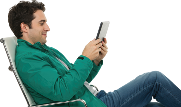 Relaxed Man Using Tablet PC While Sitting in Modern Chair Indoors