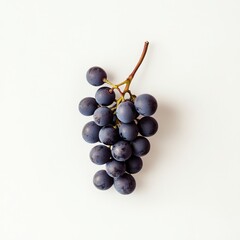 Fototapeta premium Single bunch of black grapes on white background, top view