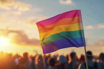 Vibrant Rainbow Flag Waving at Sunset During Outdoor Celebration of Diversity and Acceptance
