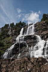Voss, Hordaland, Norway. Waterfall Tvindefossen In Spring. Largest And Highest Waterfall Of Norway. Famous Natural Norwegian Landmark And Popular Destination.
