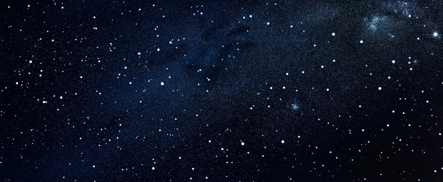 A deep blue backdrop filled with tiny white stars of equal size scattered throughout.