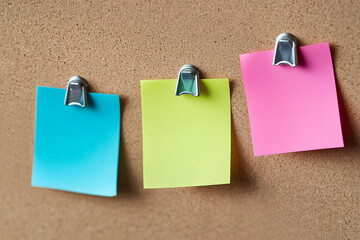 Colorful sticky notes on a cork bulletin board for planning and communication