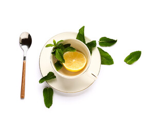 Cup with fresh mint and lemon on white background