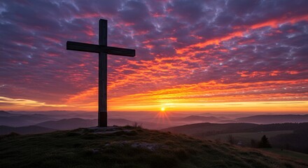 Silhouette of Cross Against Stunning Sunrise in Mountain Landscape