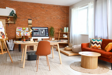 Interior designer's workplace with computer monitor in office