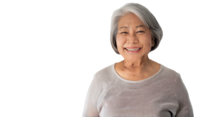 a portrait of an elderly Asian woman with a warm, genuine smile