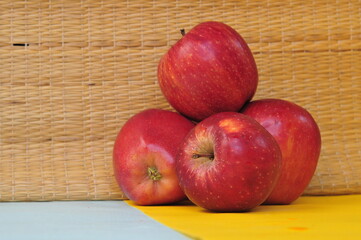 red apples on wooden table
