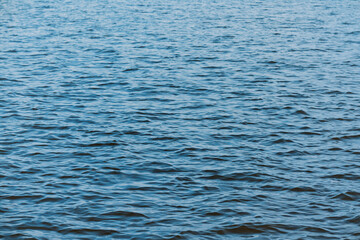 Calm ripple on water surface. River, lake, pond, sea pure blue water.