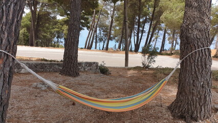 Hammock Between Trees Overlooking Sea in Lefkada, Ionian Islands, Greece

