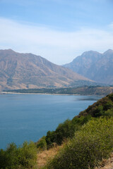 Obraz premium panorama of the Charvak reservoir and mountains on the horizon, Uzbekistan