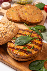Make burger buns with vegan or vegetarian patties or burgers made from soybeans, grains, vegetables, grilled healthy food