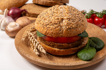 Make burger buns with vegan or vegetarian patties or burgers made from grains, vital wheat gluten food, grilled healthy food