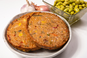 Round vegetarian patties or burgers made from grains, soybeans, vegetables and legumes