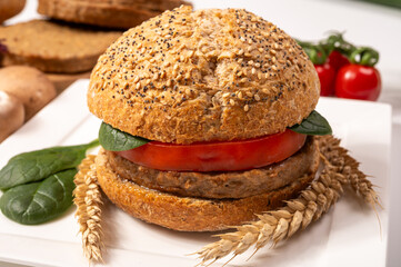 Make burger buns with vegan or vegetarian patties or burgers made from grains, vital wheat gluten food, grilled healthy food