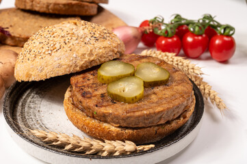 Make burger buns with vegan or vegetarian patties or burgers made from grains, vital wheat gluten food, grilled healthy food