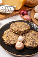 Tasty organic vegetarian food, burgers with champignons mushrooms, cheese and onion