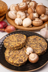 Tasty organic vegetarian food, burgers with champignons mushrooms, cheese and onion