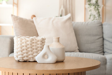 Coffee table with decor in interior of living room. Closeup