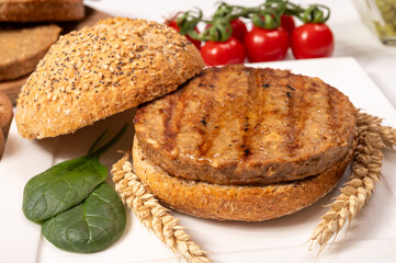 Make burger buns with vegan or vegetarian patties or burgers made from grains, vital wheat gluten food, grilled healthy food