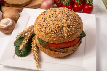 Make burger buns with vegan or vegetarian patties or burgers made from grains, vital wheat gluten food, grilled healthy food