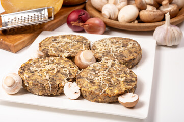 Tasty organic vegetarian food, burgers with champignons mushrooms, cheese and onion