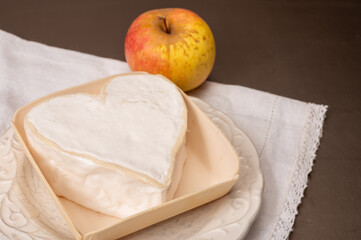 Cheese collection, French cheese from Normandy region, heart-shaped neufchatel from farm shop close up