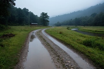 Fototapeta premium Serenity of a winding dirt road through lush greenery embracing a misty morning landscape in the countryside Generative AI