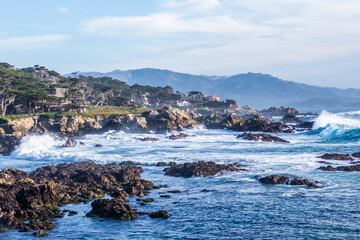 Rocky Pacific coastline with crashing waves and scenic ocean views along 17-Mile Drive, California © oldmn
