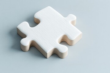 Obraz premium Single white puzzle piece on a light gray background