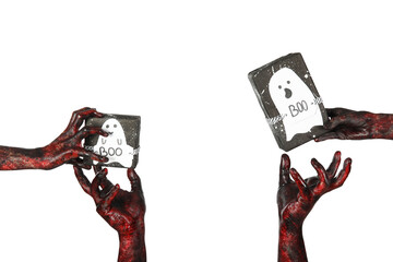 Many hands of zombies with gift boxes and ghosts made of paper on white background. Halloween...