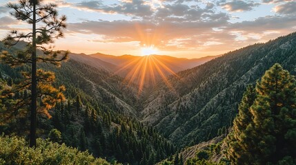 Obraz premium Stunning Sunset Over Mountain Valley in Natural Landscape