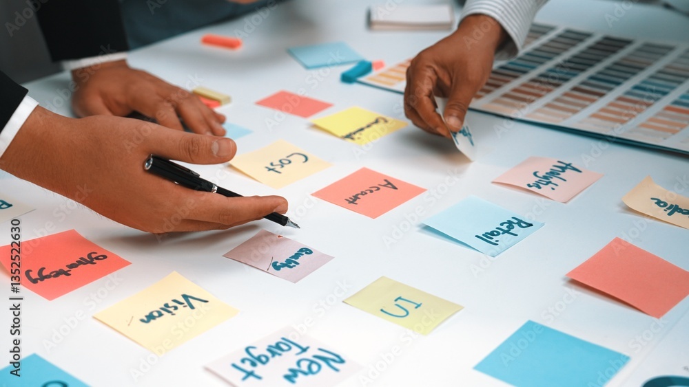 Poster a dynamic scene of collaboration where diverse hands interact with colorful sticky notes, embodying 