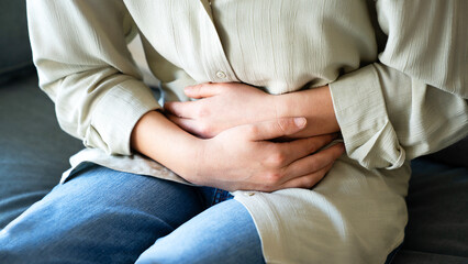 Young woman with stomach ache