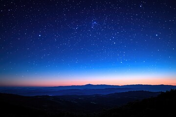 Naklejka premium A Beautiful View Of The Night Sky Above Mountains