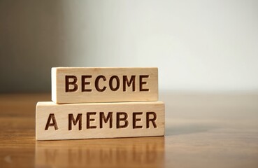 Wooden blocks spell BECOME A MEMBER. Membership sign, invitation join community. Business advertising, promo campaign for website, social media, or corporate event. Registration, subscription offer.